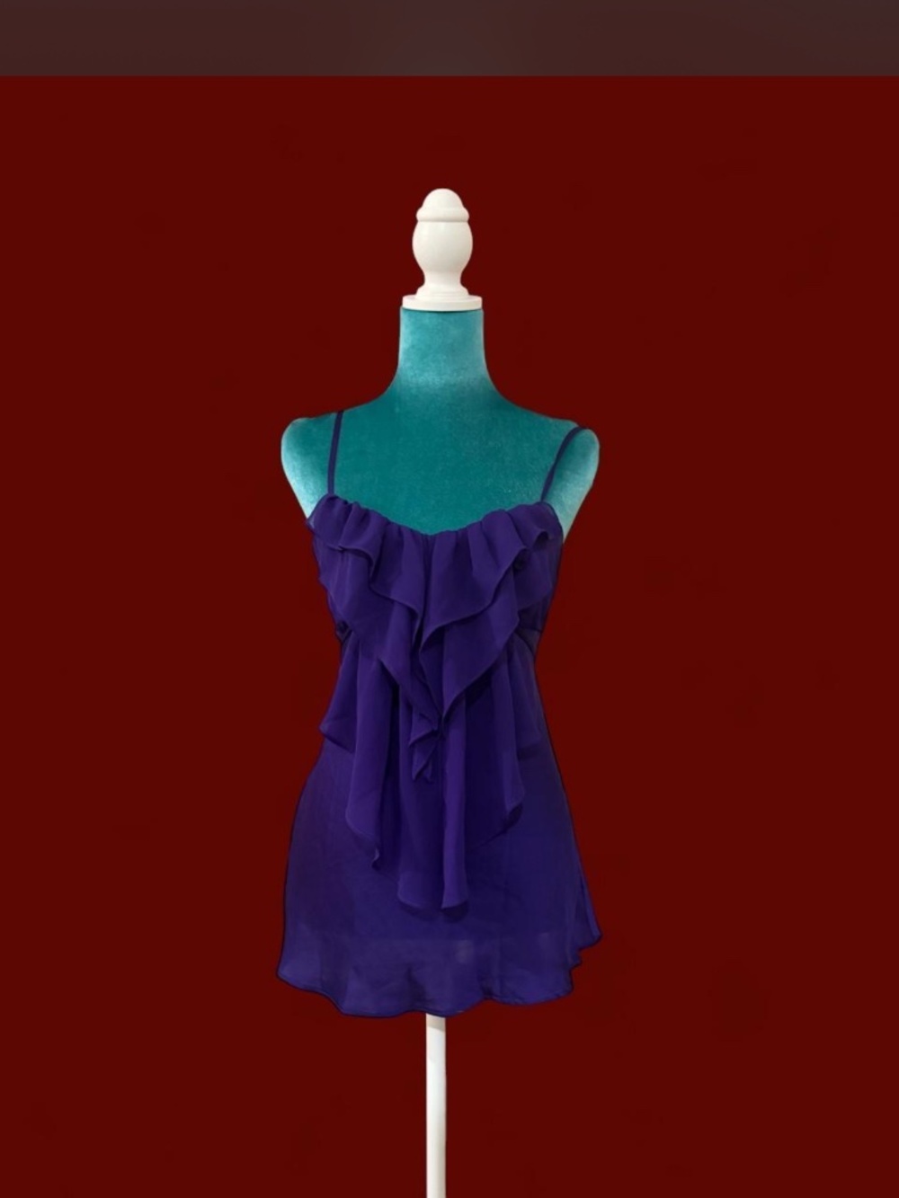 Y2K babydoll cami top in a rich purple shade featuring cascading ruffles, adjust